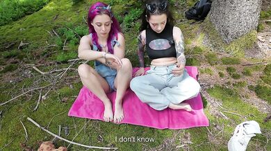 Tattooed lesbos choke squirt in the forest while french oral goes wild