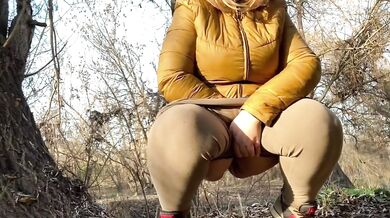 Wet and squatting a hairy milf lets rip outdoors