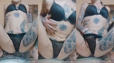 Golden nectar drips down her tattooed thighs