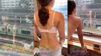 A petite Japanese beauty flashing from the hotel window to the train platform