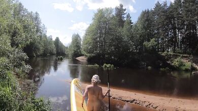 Russian exhibitionist gushes wild on nude SUP hike