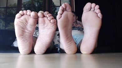 Thick wrinkled soles grind under heels twixt lesbian toes