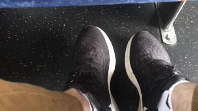 My bushy man feet pressed tight on public bus Australia